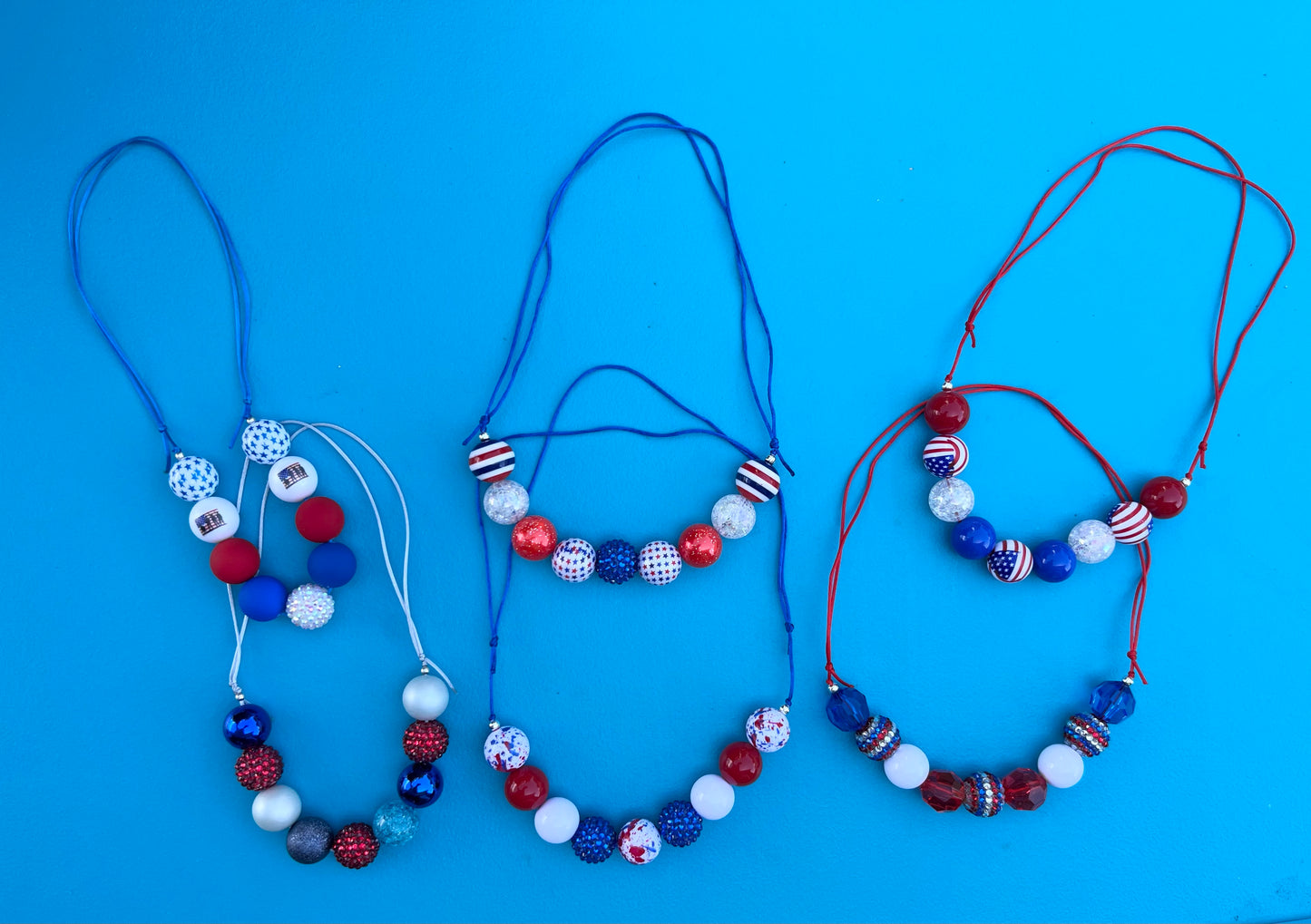 RWB Necklaces, bracelets and pens